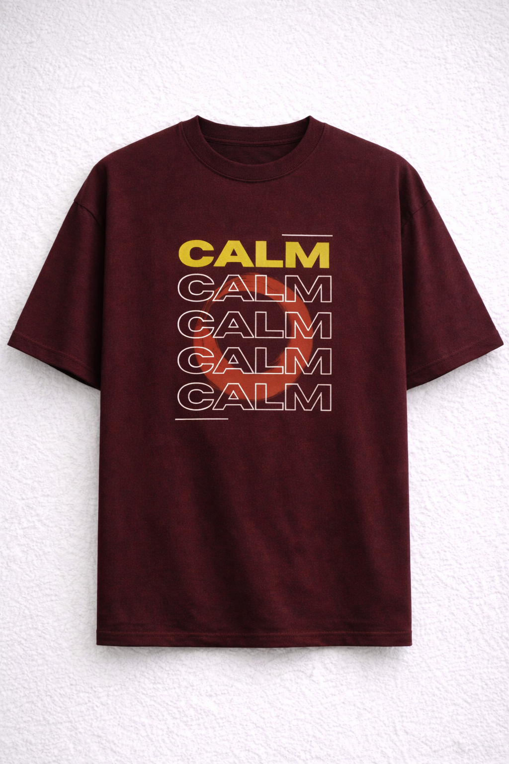 Maroon t-shirt with 'CALM' text in various colors on a white background